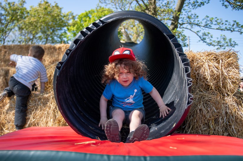 Children playing on the straw bale castle and tunnel slide at East Scryne Fruit.  Photograph © The Courier, D C Thompson, 2025